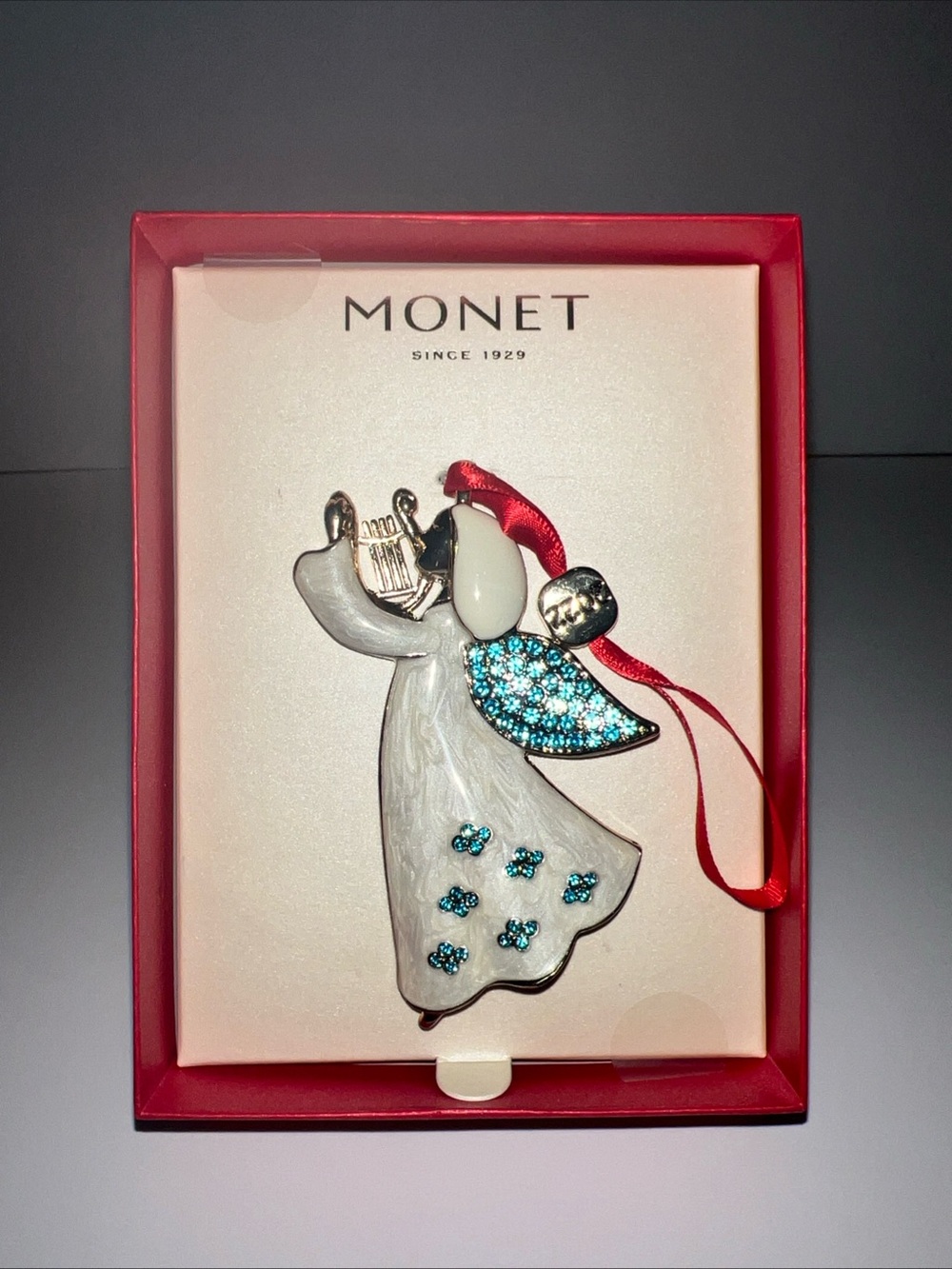 Monet White and Turquoise Angel 2022 Ornament with Red Ribbon